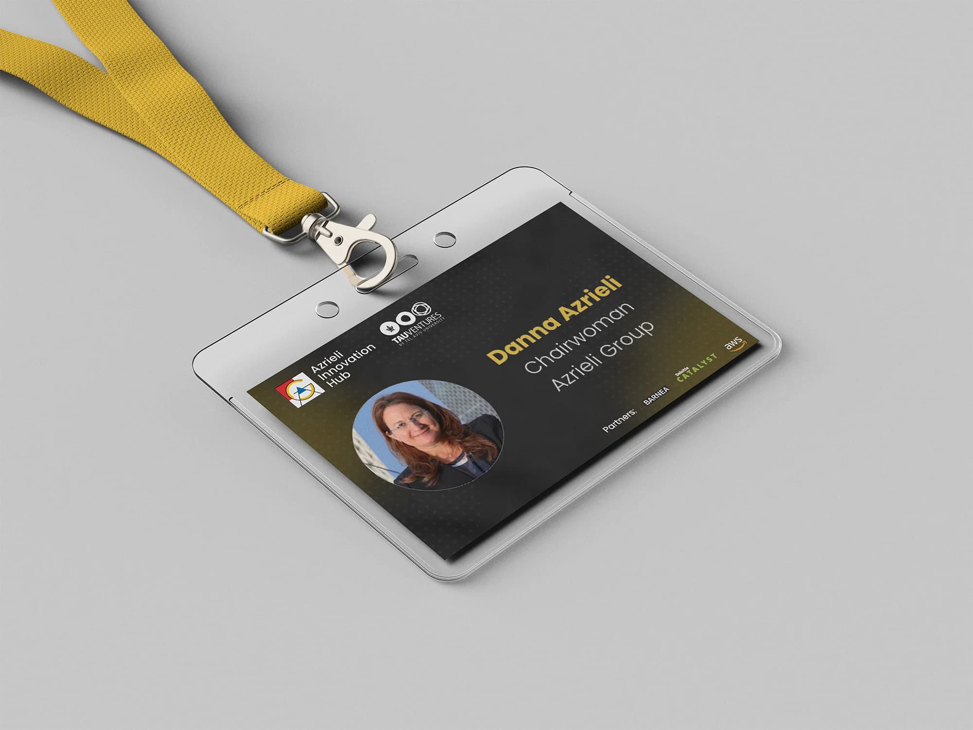 Speaker badge on a yellow lanyard