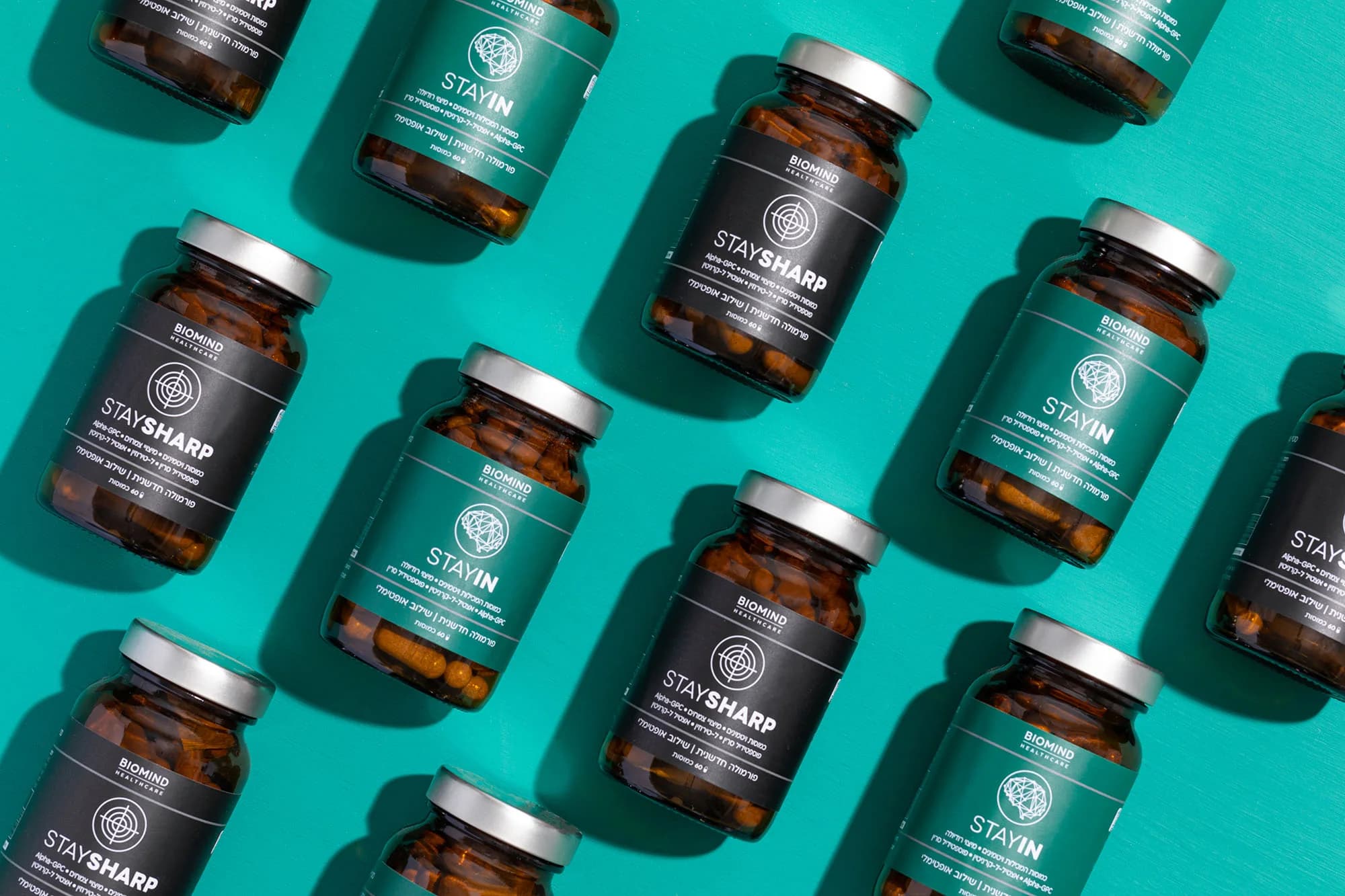 Biomind bottles on a teal background