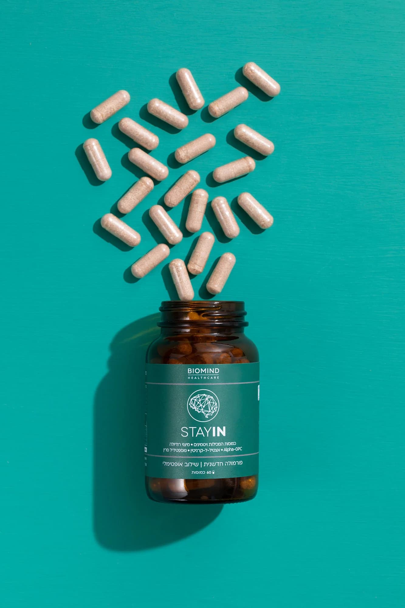Biomind capsules spilling from the bottle